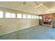 Spacious basement with brick fireplace and multiple windows for natural light at 1822 Ura Ln, Northglenn, CO 80234