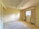 Bedroom with neutral walls and carpet, bright window with curtains, ceiling texture at 1822 Ura Ln, Northglenn, CO 80234