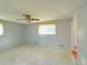 Bedroom features a ceiling fan and a window letting in natural light at 1822 Ura Ln, Northglenn, CO 80234