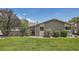 Backyard features privacy fence, mature landscaping and lush green grass at 21 Douglas N Dr, Broomfield, CO 80020