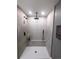 Modern bathroom features a walk-in shower with decorative tile and a rainfall shower head at 21 Douglas N Dr, Broomfield, CO 80020