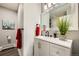 Modern bathroom features updated vanity with solid surface counters at 21 Douglas N Dr, Broomfield, CO 80020