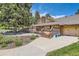Community clubhouse featuring an outdoor deck and landscaping at 21 Douglas N Dr, Broomfield, CO 80020