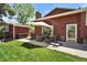 Charming backyard showcasing a patio with outdoor seating and a well-maintained lawn for relaxation at 8065 W Fremont Dr, Littleton, CO 80128