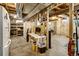 An unfinished basement offering open space, storage, and potential for customization with ample square footage at 8065 W Fremont Dr, Littleton, CO 80128