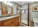 Modern bathroom with a spacious shower, vanity, and elegant finishes at 8065 W Fremont Dr, Littleton, CO 80128