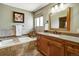 Stylish bathroom with a soaking tub, vanity, and elegant tile work at 8065 W Fremont Dr, Littleton, CO 80128