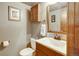 Charming powder room with a decorative sink, cabinet, and stylish fixtures at 8065 W Fremont Dr, Littleton, CO 80128