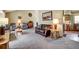 Cozy living room with neutral carpet, warm wall color, and comfortable seating arrangement at 8065 W Fremont Dr, Littleton, CO 80128