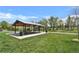 Park pavilion on a large lawn, complete with picnic tables at 8065 W Fremont Dr, Littleton, CO 80128
