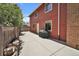 Patio with a grill and stacked logs, surrounded by a fenced yard at 8065 W Fremont Dr, Littleton, CO 80128