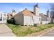 A charming townhouse featuring neutral siding, brown roofing, chimney and well-kept lawn in a suburban setting at 13635 E Yale Ave # D, Aurora, CO 80014