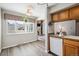 Eat in kitchen features view into living room, great natural light and functional kitchen space at 13635 E Yale Ave # D, Aurora, CO 80014