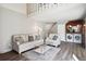 Comfortable living room featuring neutral tones, modern decor, washer, dryer and staircase to the second floor at 13635 E Yale Ave # D, Aurora, CO 80014
