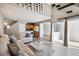 Spacious living room with modern decor, open floor plan, and sliding glass doors for natural light at 13635 E Yale Ave # D, Aurora, CO 80014