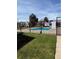 Community pool area surrounded by lush greenery and fenced in for safety at 13635 E Yale Ave # D, Aurora, CO 80014