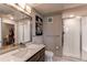 Modern bathroom with a glass-enclosed shower, floating vanity, and neutral décor at 155 S Monaco Street Pkwy # 311, Denver, CO 80224