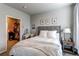 Relaxing bedroom featuring a queen bed, vanity and an organized walk-in closet at 155 S Monaco Street Pkwy # 311, Denver, CO 80224