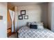 Comfortable bedroom with modern decor, a bed with decorative pillows, and nearby dressing area at 155 S Monaco Street Pkwy # 311, Denver, CO 80224