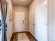 Entryway with hardwood floors, decorative rug, and a hallway closet at 155 S Monaco Street Pkwy # 311, Denver, CO 80224
