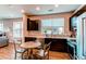 Well-lit kitchen featuring dark cabinets, stainless steel appliances, and light countertops at 155 S Monaco Street Pkwy # 311, Denver, CO 80224