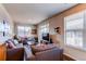 Cozy living room with comfortable gray sofas, a rustic coffee table, and natural light at 155 S Monaco Street Pkwy # 311, Denver, CO 80224