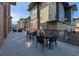 Large patio space with outdoor seating and tables perfect for gathering and relaxing at 155 S Monaco Street Pkwy # 311, Denver, CO 80224