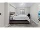Finished basement bedroom has plush carpeting, a queen sized bed, and ample lighting at 5611 S Sicily Cir, Aurora, CO 80015