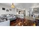 Spacious living area flowing into kitchen and dining space, creating an open and airy atmosphere at 5611 S Sicily Cir, Aurora, CO 80015