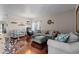 Inviting living room featuring hardwood floors, comfortable seating, and stylish decor, creating a cozy atmosphere at 5611 S Sicily Cir, Aurora, CO 80015