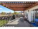 Outdoor patio featuring a wooden pergola, outdoor furniture, a grill, and an open view at 5611 S Sicily Cir, Aurora, CO 80015