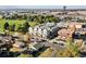 Aerial shot showcasing a modern townhome community near a park, with easy access to urban amenities and green spaces at 7035 E 38Th Ave # 4, Denver, CO 80207