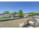 Relaxing balcony view overlooking a peaceful neighborhood street with mature trees and greenery at 7035 E 38Th Ave # 4, Denver, CO 80207