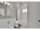 Modern bathroom featuring a shower-over-bath, floating vanity and modern fixtures at 7035 E 38Th Ave # 4, Denver, CO 80207