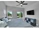 Well-lit bedroom featuring two windows, ceiling fan and modern storage unit with drawers at 7035 E 38Th Ave # 4, Denver, CO 80207