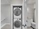 Efficient laundry closet features a stacked washer and dryer, conveniently located near the bathroom at 7035 E 38Th Ave # 4, Denver, CO 80207