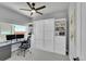 Bright office area featuring built-in shelving and desk, with a Murphy bed at 7035 E 38Th Ave # 4, Denver, CO 80207