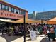 Vibrant outdoor seating area at Station 26 Brewing with shaded tables, perfect for socializing at 7035 E 38Th Ave # 4, Denver, CO 80207