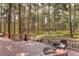 Backyard deck with wood railing featuring wooded views, seating and a serene atmosphere at 70 Long Bow Cir, Monument, CO 80132
