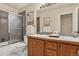 Neutral bathroom with a glass enclosed shower and dual sinks at 70 Long Bow Cir, Monument, CO 80132