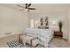 Neutral bedroom with a large bed, artwork and simple furnishings at 70 Long Bow Cir, Monument, CO 80132