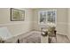 Bright bedroom featuring a large window, neutral walls, and comfortable seating at 70 Long Bow Cir, Monument, CO 80132