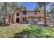 Charming two-story Tudor home with brick and stucco accents and a manicured lawn at 70 Long Bow Cir, Monument, CO 80132
