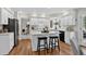 Modern kitchen with white cabinets, stainless steel appliances, and a central island with bar seating at 70 Long Bow Cir, Monument, CO 80132