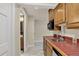 Cozy kitchenette area features tile countertops, wood cabinets, and a convenient microwave at 70 Long Bow Cir, Monument, CO 80132