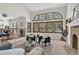 Spacious living room featuring a wall of windows, fireplace and comfortable seating at 70 Long Bow Cir, Monument, CO 80132