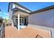 Inviting back deck with an open-air design, complete with stylish outdoor seating and charming string lights at 6632 Osage St, Denver, CO 80221
