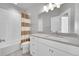 Bathroom with white vanity, new lighting, tiled shower and flooring at 6632 Osage St, Denver, CO 80221