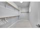 Walk-in closet featuring multiple levels of shelving and hanging storage space at 6632 Osage St, Denver, CO 80221