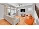 Bright living room featuring lots of natural light, hardwood floors, and comfortable seating arrangements at 6632 Osage St, Denver, CO 80221